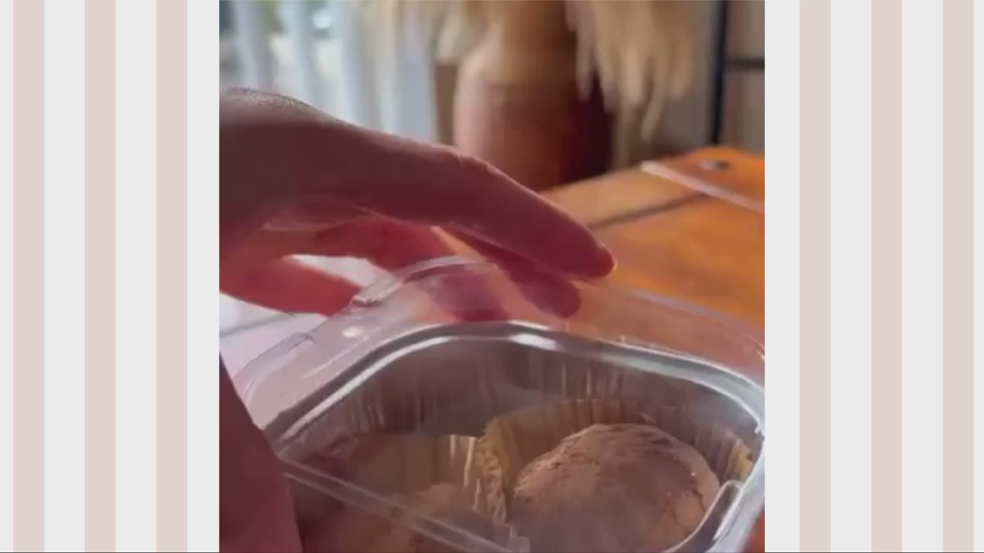 Load video: A thick, gourmet chocolate Dubai cookie from Cookie Tabs held by a person, highlighting the artisanal texture and large chocolate chunks.